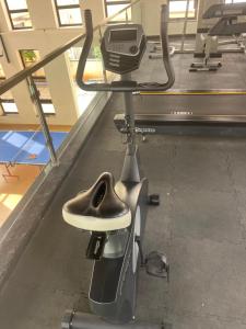 a moped with a seat in a gym at VVR villa in Tirupporūr +30 photos