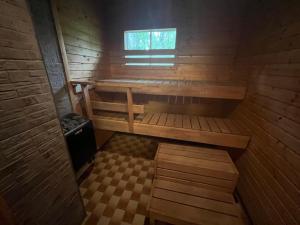 an inside view of a wooden cabin with a window at Arola 2 in Syöte
