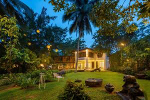 a house in the middle of a yard at Wasala Banquets & Nature Resort in Radawana