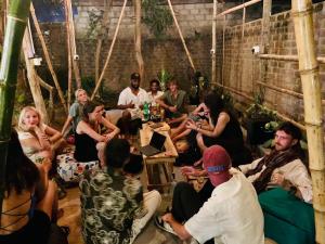 a group of people sitting in a room at Moonlight surf hostel in Arugam Bay