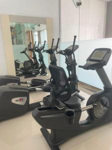 a row of exercise bikes in a gym at Hotel Sentral Pudu @ City Centre / Bukit Bintang in Kuala Lumpur