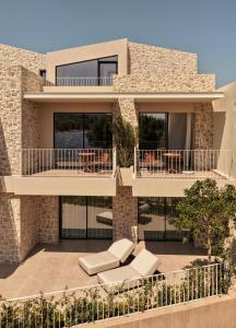 a rendering of a house with two balconies at Petra Mare Villas in Psathopyrgos