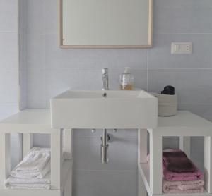 a bathroom with a white sink and a mirror at Il quadrifoglio in Serino