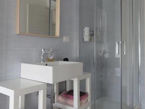 a bathroom with a white sink and a shower at Il quadrifoglio in Serino