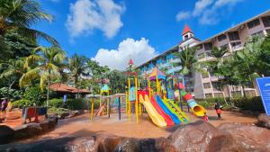 a playground in front of a hotel at Lotus Desaru Beach Resort & Spa in Desaru