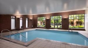a large swimming pool in a building at Hyatt Place Columbus/OSU in Columbus