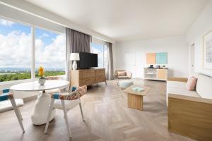 a living room with a couch and a table at Hyatt Centric San Juan Isla Verde in San Juan