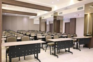 a conference room with tables and chairs in it at Ramada by Wyndham Duzce in Duzce