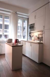 Kuchyň nebo kuchyňský kout v ubytování Appartamento Dante