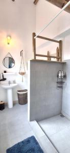 a bathroom with a sink and a mirror at Bay Rose in Pointe d'Esny +11 photos