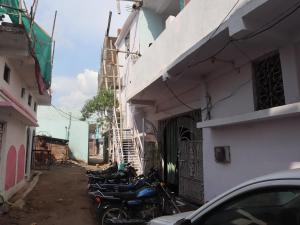 a group of motorcycles parked next to a building at Harshvardhan Lodge in Narsimhapur