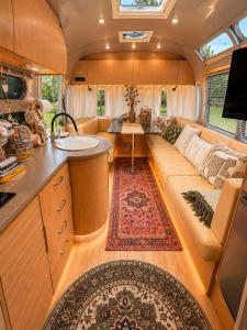 a living room and kitchen in an rv at Bieszczadzki Airstream in Wetlina