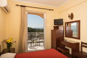 TV a/nebo společenská místnost v ubytování Sunset Hotel