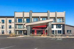 an empty parking lot in front of a building at The Valor, an Ascend Collection Hotel in Parowan