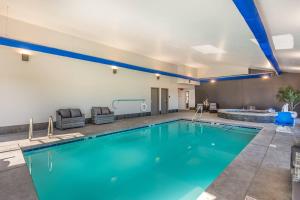 a large swimming pool in a building with a swimming pool at The Valor, an Ascend Collection Hotel in Parowan