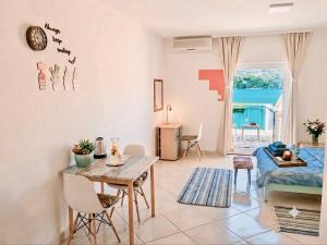 a living room with a table and a couch at Apartments Djurovic in Kotor