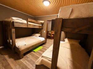 a room with two bunk beds and a table at Villas alpinas in Concepción de La Vega +20 photos