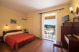 Postel nebo postele na pokoji v ubytování Sunset Hotel