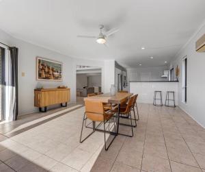 a dining room and kitchen with a table and chairs at Smada Stay - 4BR, Waterfront, Perfect Entertainer in Port Lincoln