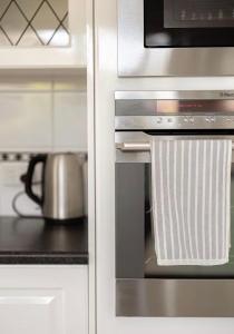 a kitchen with a stainless steel oven with a microwave at Smada Stay - 4BR, Waterfront, Perfect Entertainer in Port Lincoln