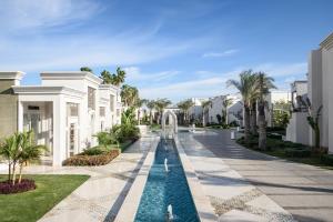 a resort with a fountain and palm trees at Sunrise Remal Beach Resort in Sharm El Sheikh +44 photos