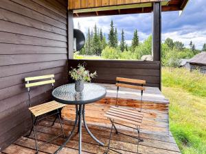 a patio with a table and two chairs and a window at 4 person holiday home in gol in Gol