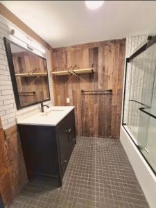 a bathroom with a sink and a mirror and a shower at Lumen Catskill NY in Roscoe +64 photos