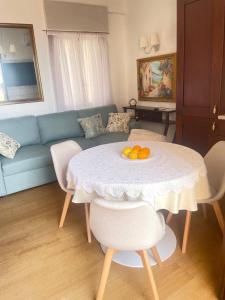 a living room with a table with oranges on it at Marina Panoramic Sea View in Scalea