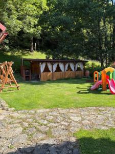 a yard with a playground with a play structure at Domki Pod Jesionami in Stronie Śląskie