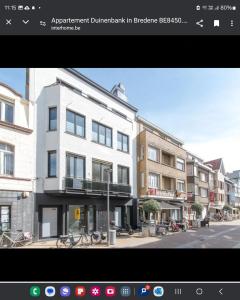 a rendering of a building in a city at Duinenbank in Bredene
