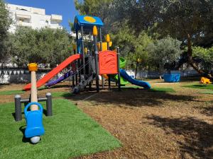 a park with a playground with slides and swings at Europa Grand Vlora in Vlorë