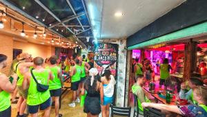 a group of people standing in front of a store at Blanco Central in Phi Phi Islands