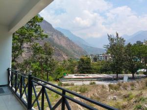 a balcony with a view of a mountain at Hotel Shri Mahavir in Chamoli