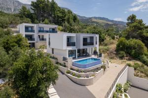 an aerial view of a villa with a swimming pool at Villa LUX 55 in Tučepi