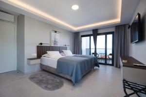 a bedroom with a bed and a view of the ocean at Villa LUX 55 in Tučepi +31 photos