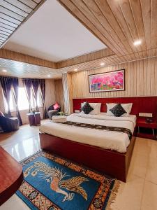 a bedroom with a bed with a dragon on it at Hotel Best Inn in Darjeeling