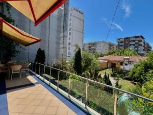 a balcony with a view of a city at Vila Mani in Durrës
