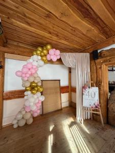 a room with a bunch of balloons on the wall at Noclegi Pod Muńcołem in Ujsoły +23 photos