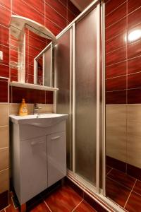 a bathroom with a sink and a shower at The Old Town Hostel-Villa Gradac in Dubrovnik +28 photos