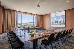 a large conference room with a long table and chairs at Grand Dominium in Agadir +70 photos
