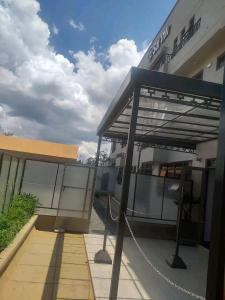 a view of a building with a metal roof at Sai Inn Eldoret in Eldoret +15 photos