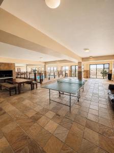 a large room with a ping pong table in it at Klein paradys Jeffreys bay in Jeffreys Bay