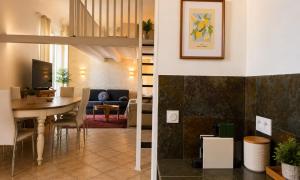 two views of a living room and a dining room at Sunset Villa atypical with air conditioning in Nice