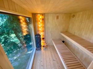 an empty sauna with a large window in it at Agroturystyka Blicharzówka Noclegi in Bukówka