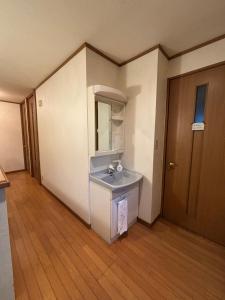 a bathroom with a sink and a mirror and a door at ENZAN STAYS Yamanashi in Enzan +45 photos