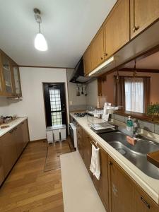 a kitchen with a sink and a counter top at ENZAN STAYS Yamanashi in Enzan