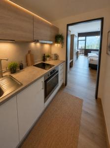 a kitchen with a sink and a counter top at Dachstein Blick in Bad Goisern