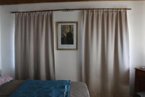 a bedroom with a bed and a picture on the wall at Südpfalz in Barbelroth