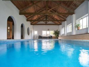 a large swimming pool with a wooden ceiling at Shippon - Ukc9529 in Barnstaple
