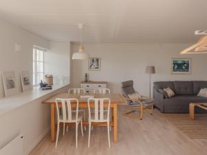 a kitchen and living room with a table and chairs at Äleklinta in Äleklinta +41 photos